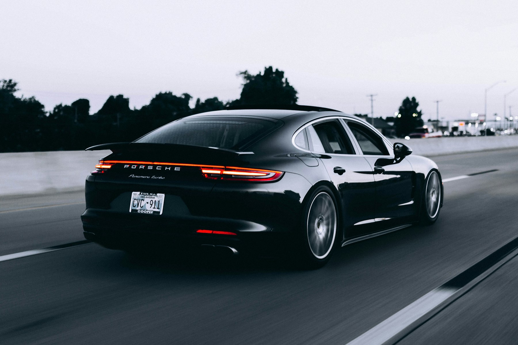 Sports car driving on an open road